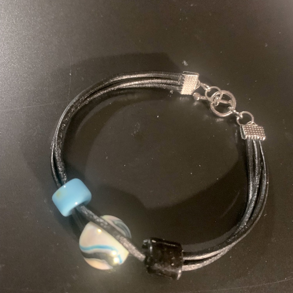 Hand crafted with groovy love by K.B. Leather blue beaded bracelet